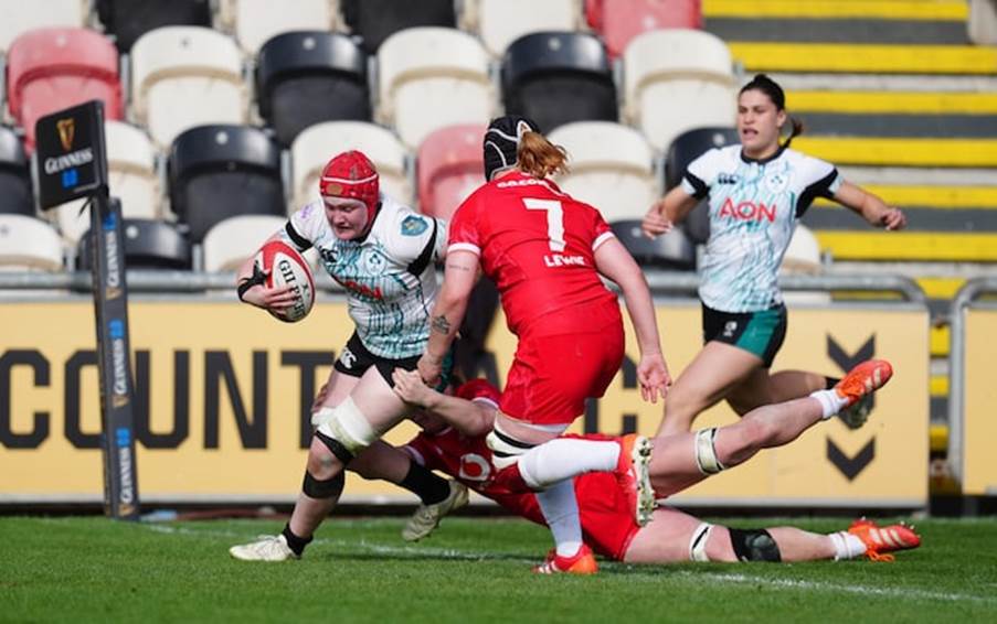 Ireland's Aoife Wafer scores a try